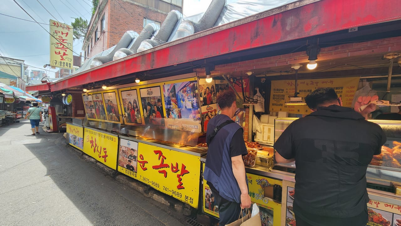Open-front counter of Changsin-dong Spicy Jokbal in a narrow market alley near Dongdaemun