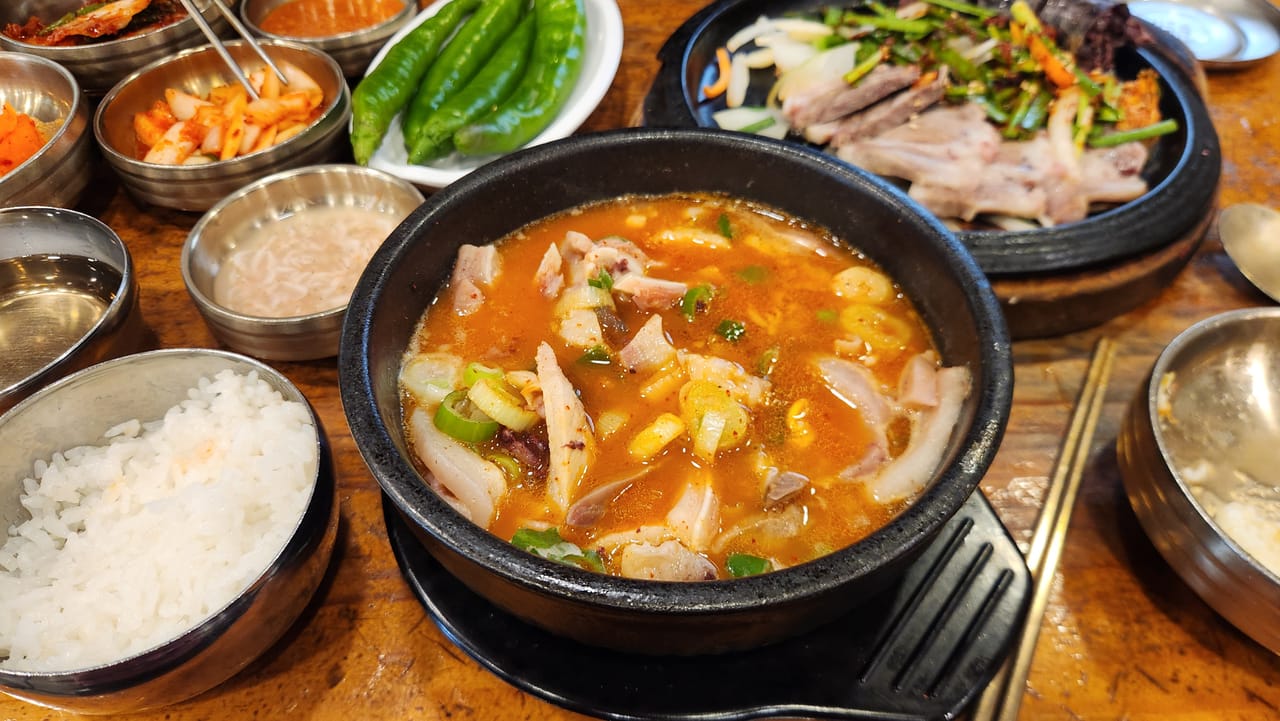 Spicy orange sundae gukbap with Korean blood sausage and pork at Ibukjip Chapssal Sundae